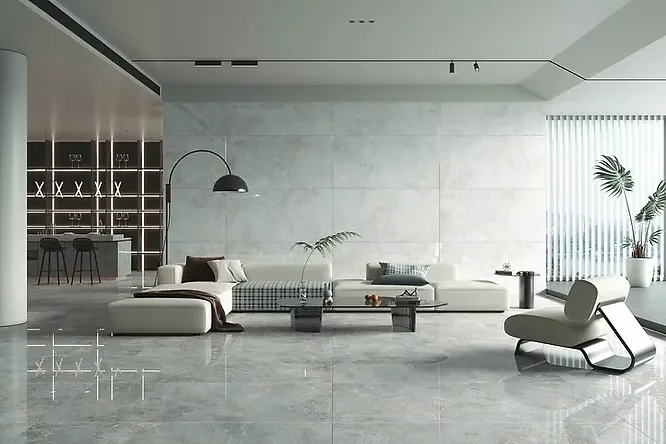 A spacious, minimalist living room with glossy grey marble flooring and a white sectional sofa.