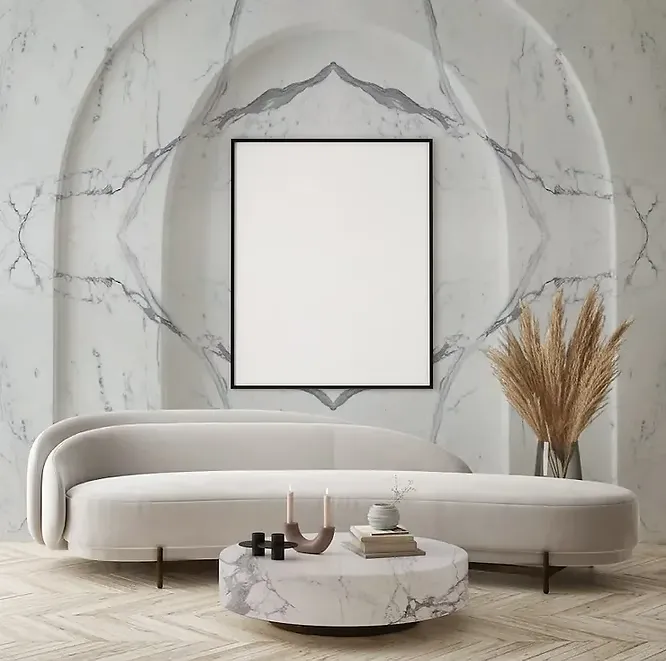 An elegant, neoclassical-inspired living room showcasing an arched, bookmatched white marble feature wall with striking dark grey veins behind a curved plush sofa.