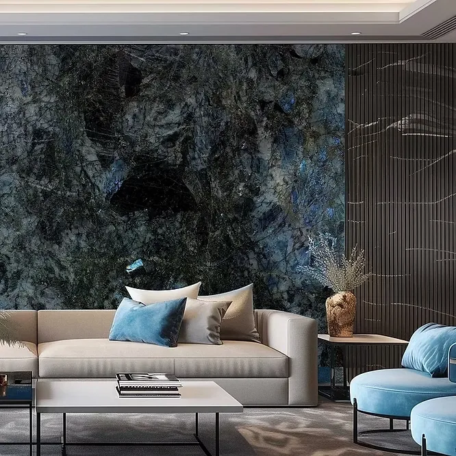 A luxury contemporary living room featuring a dramatic, dark blue and black granite feature wall with shimmering crystalline textures behind a modern sofa.