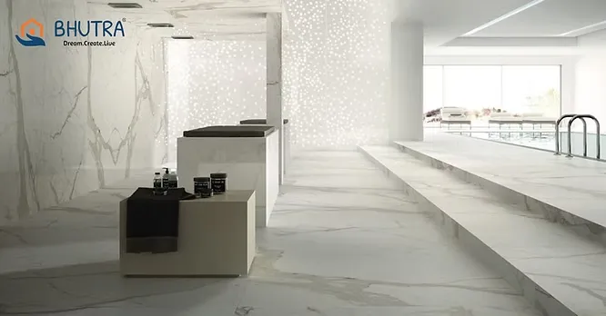 A serene, minimalist spa interior by Bhutra Marble & Granite utilizing expansive white marble tiles across the floor and stepped platforms.