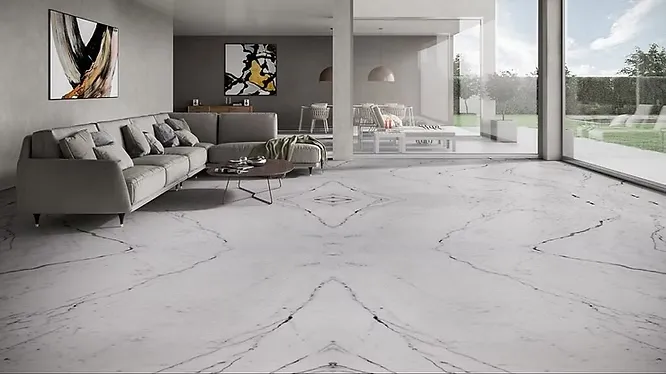 A vast, minimalist living room displaying an exquisite bookmatched white marble floor with symmetric, dark veining.
