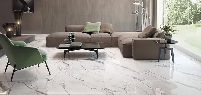 A sophisticated open-concept lounge area outfitted with large-format, glossy white marble floor tiles displaying fine grey veining.