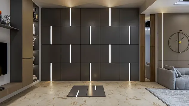 Minimalist room featuring a large grey wall with bright vertical LED strip lights and a grey couch.