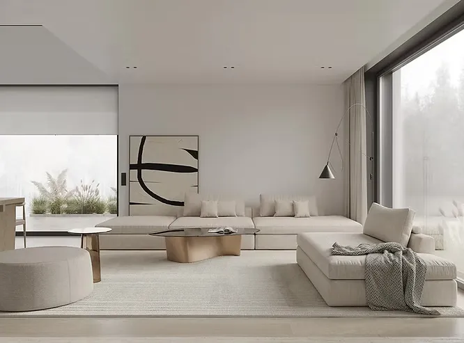 Spacious neutral lounge illustrating key elements of minimalist interior design with clean lines, a low sofa, and abstract art.