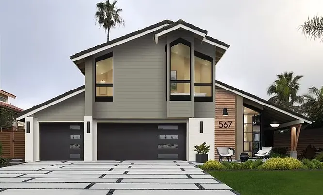 Modern house exterior showing monochrome palettes and natural tones with dark grey walls and a warm wood garage door.