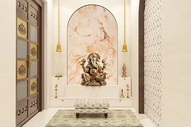Beautiful pooja room with an arched veined marble backdrop, a large brass Ganesha idol, hanging bells, and a lotus-motif door.