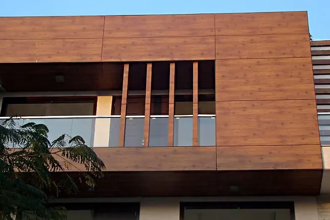 These wood-finish HPL panels give exteriors a warm, rich look while being UV-resistant, weatherproof, and easy to maintain.