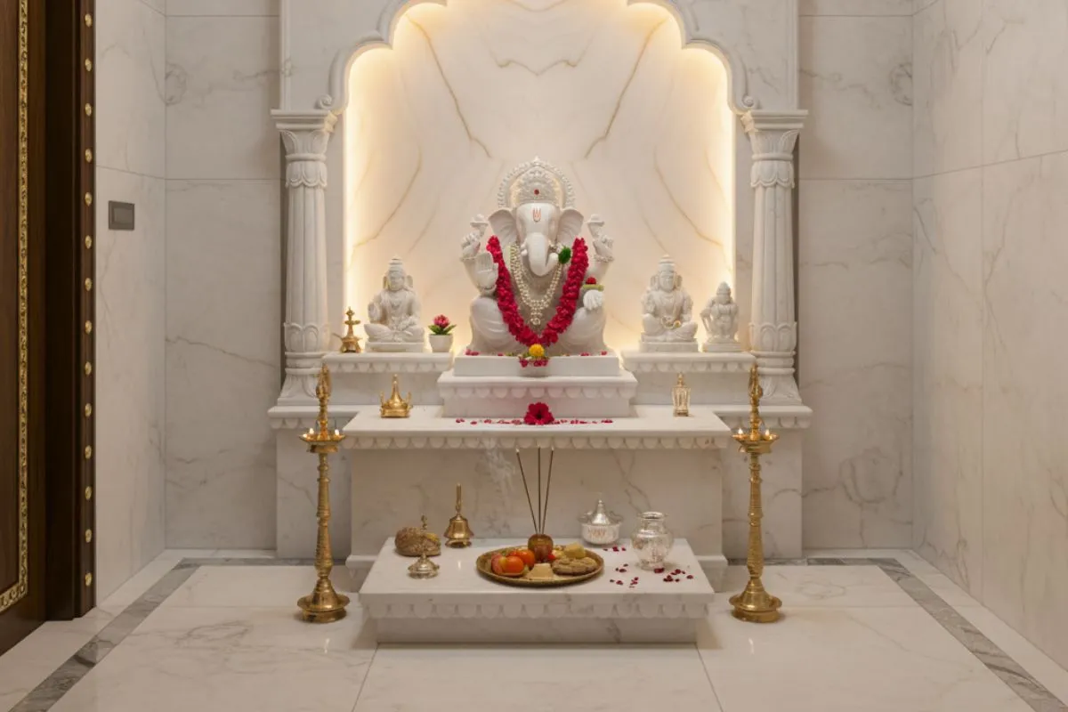 Luxurious Pooja Room Designs with all-white marble, including walls and flooring, showcasing a clean, bright, and traditional aesthetic.
