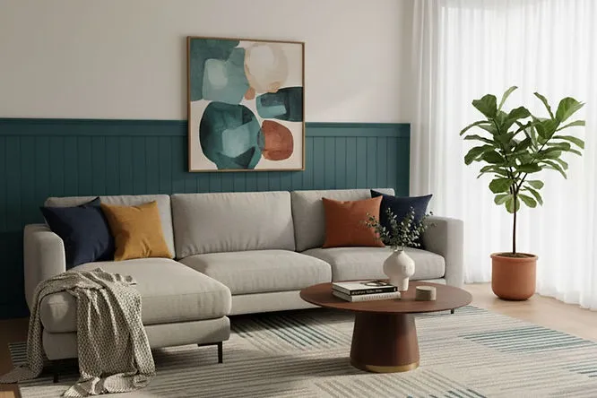 A creative space featuring a mint green and lavender color-blocked wall. These playful Living Room Paint Ideas offer a fresh, modern look that anyone can try at home.