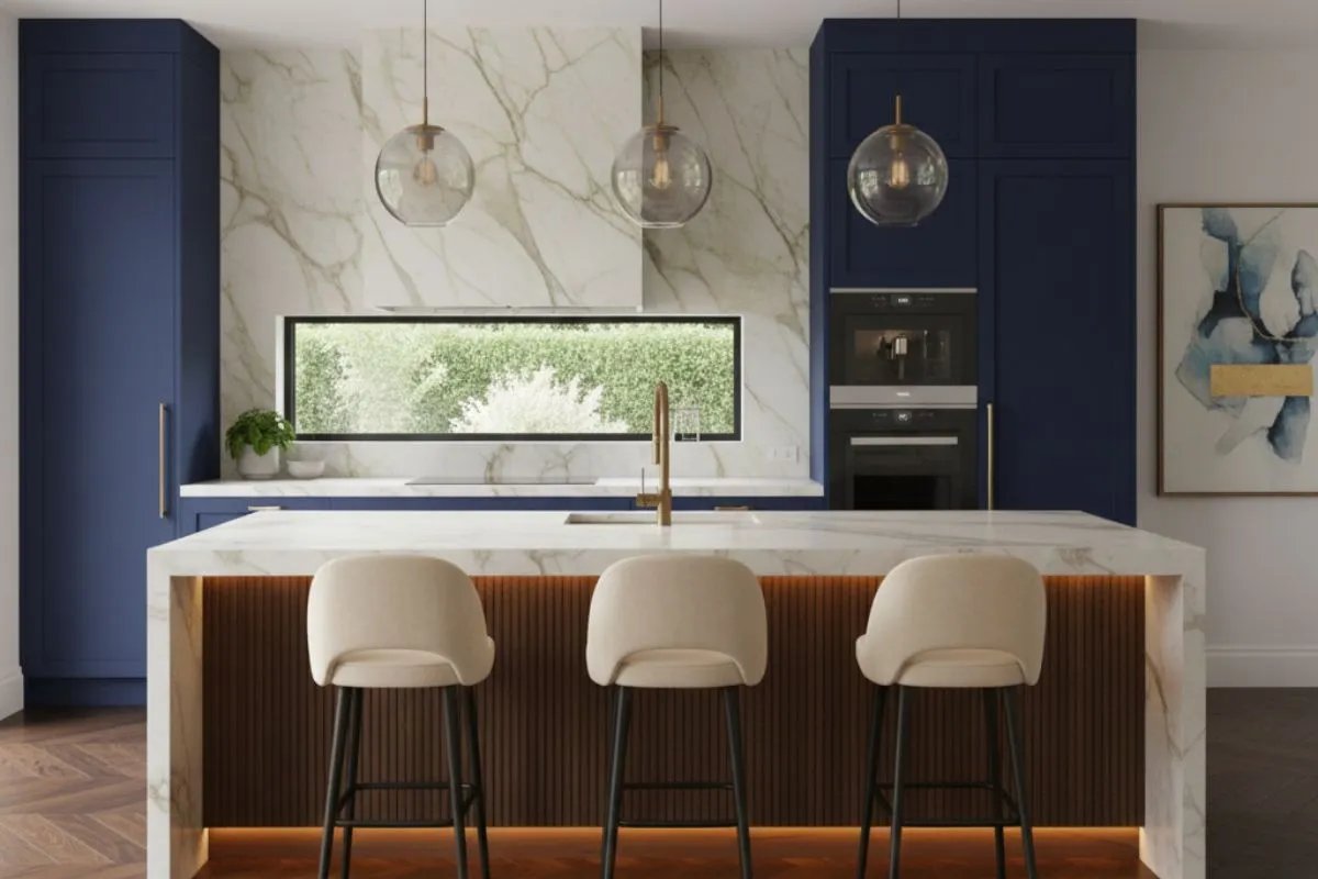 Modern island kitchen with blue cabinets and marble tops. As one of the top types of kitchen, it provides a central space for cooking and eating in a smart, stylish home design.