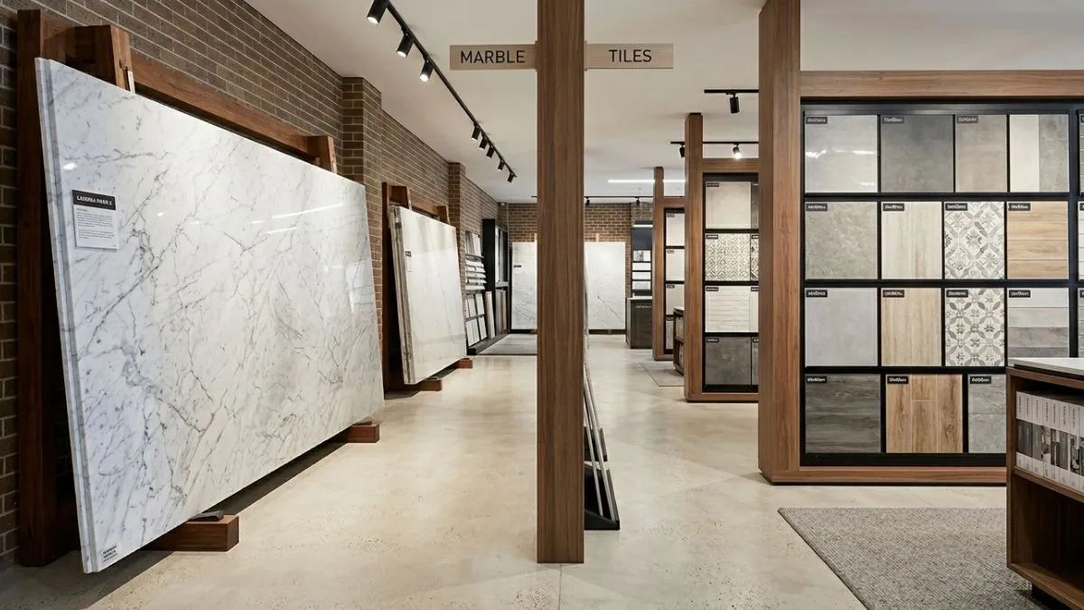 A modern store displaying a direct Marble vs Tiles selection side by side.