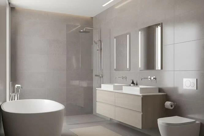 Modern grey tiles with sleek silver taps. This bathroom decor uses wall-mounted fixtures to keep surfaces clear. Simple shapes and smooth finishes make wiping away water spots quick and easy.