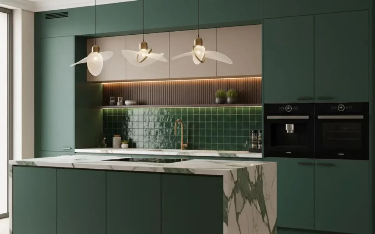 A luxurious green modular kitchen with a white marble island, glossy green tiled backsplash, and artistic pendant lights.