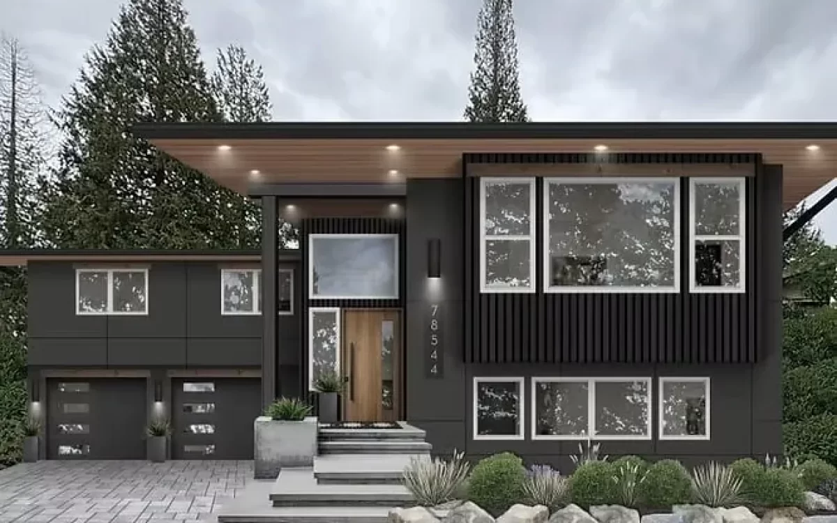 Sleek, modern two-story home featuring a sophisticated dark charcoal exterior finish accented by warm wood under-eaves.