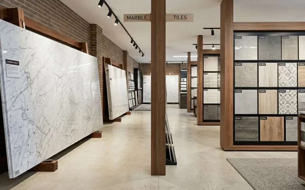 A modern store displaying a direct Marble vs Tiles selection side by side.