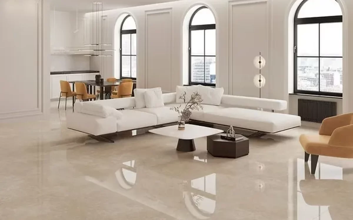 High-end open-plan living area featuring seamless, glossy marble flooring that highlights luxury home interior trends.